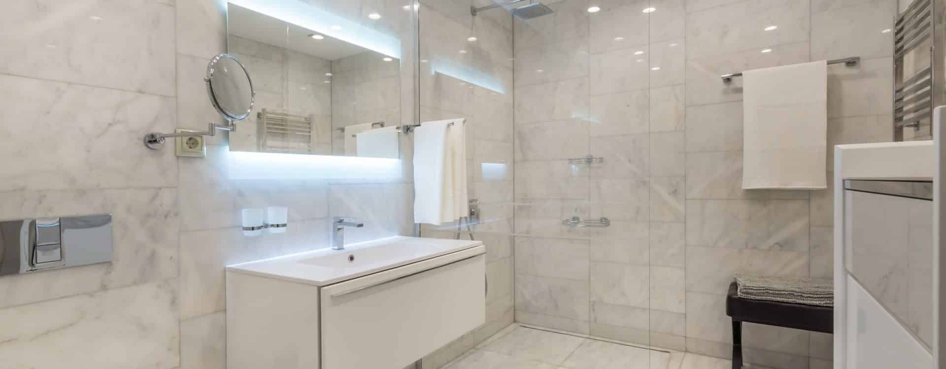Contemporary bathroom design with wooden floor accents and modern fixtures.