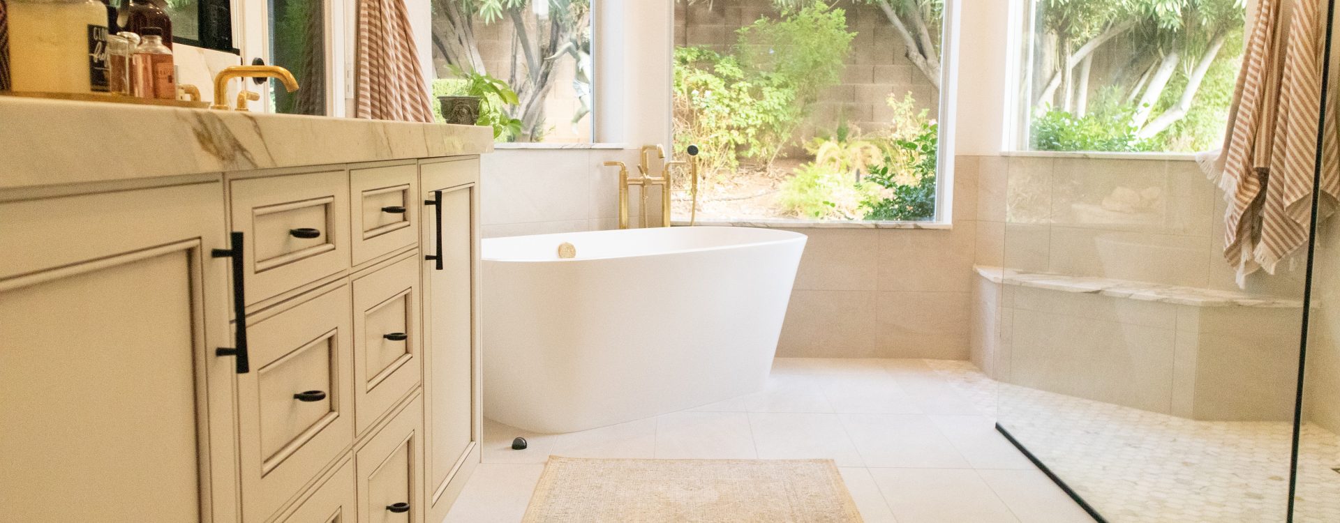Bright and airy bathroom interior with natural light and a touch of greenery.