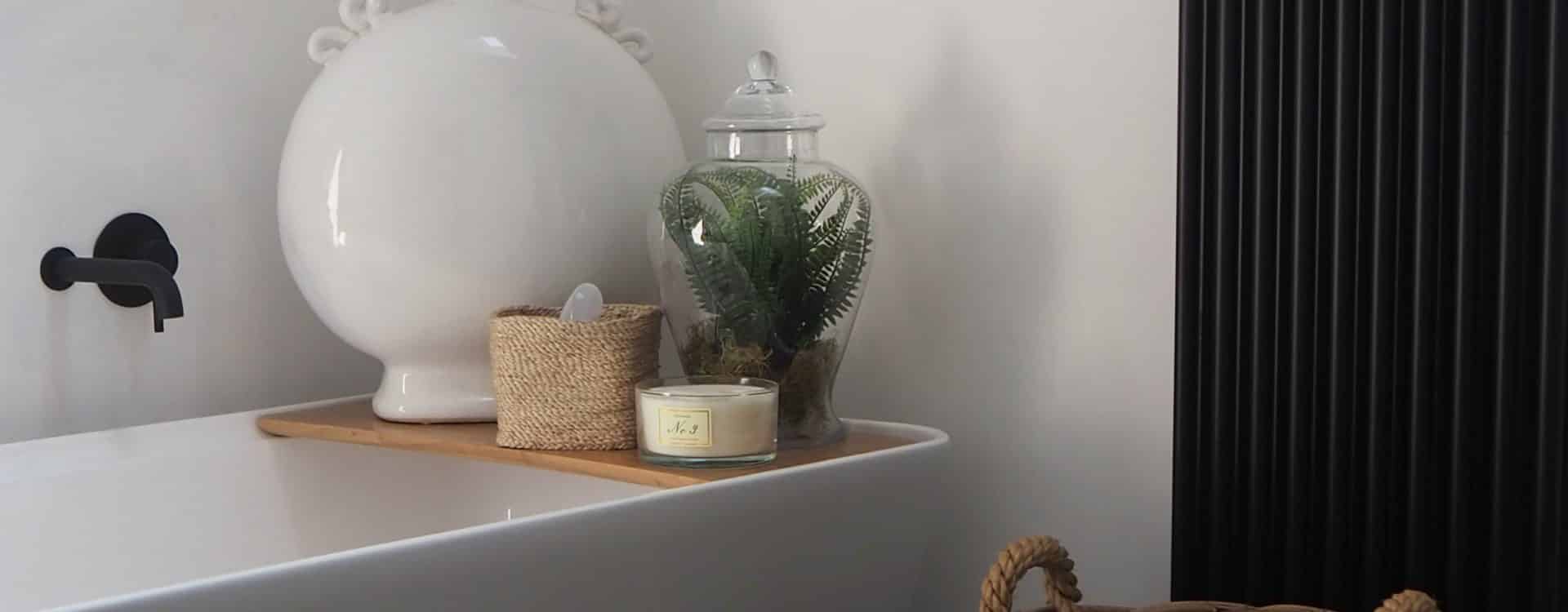 Vintage-inspired bathroom featuring a classic clawfoot tub and retro tiles.