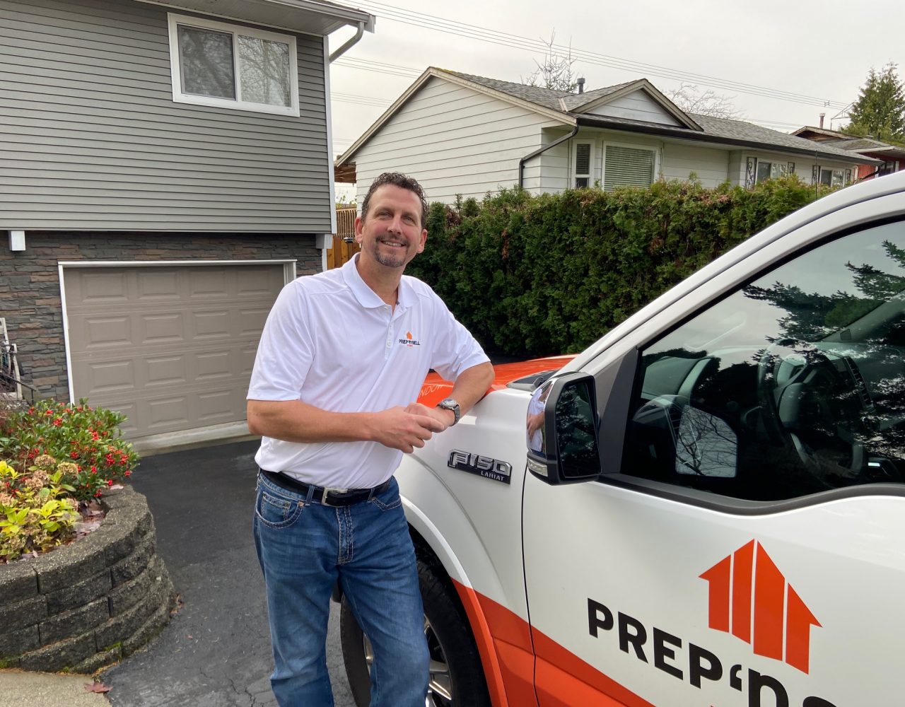 Prep'n Sell Langley's trusted branded truck in front of a newly staged home ready for sale