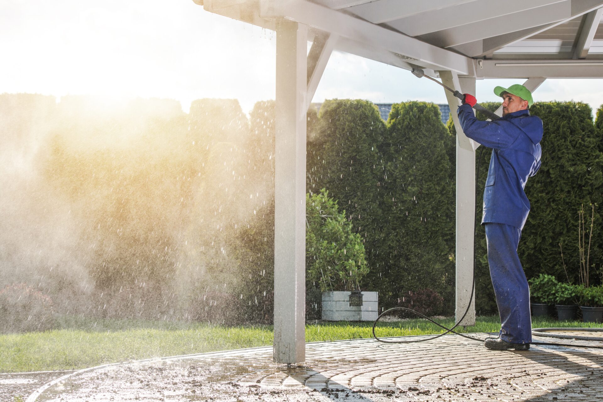 Worker pressure-washing exterior surface - Prep'n Sell (2025)