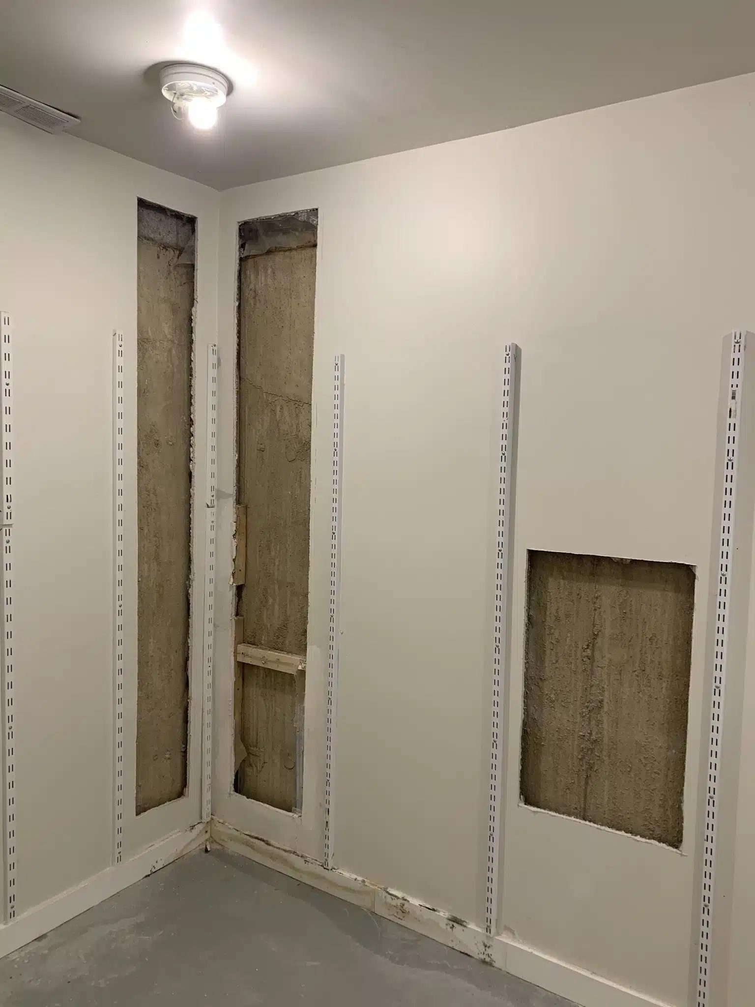 Before: wall repair needed in Langley home