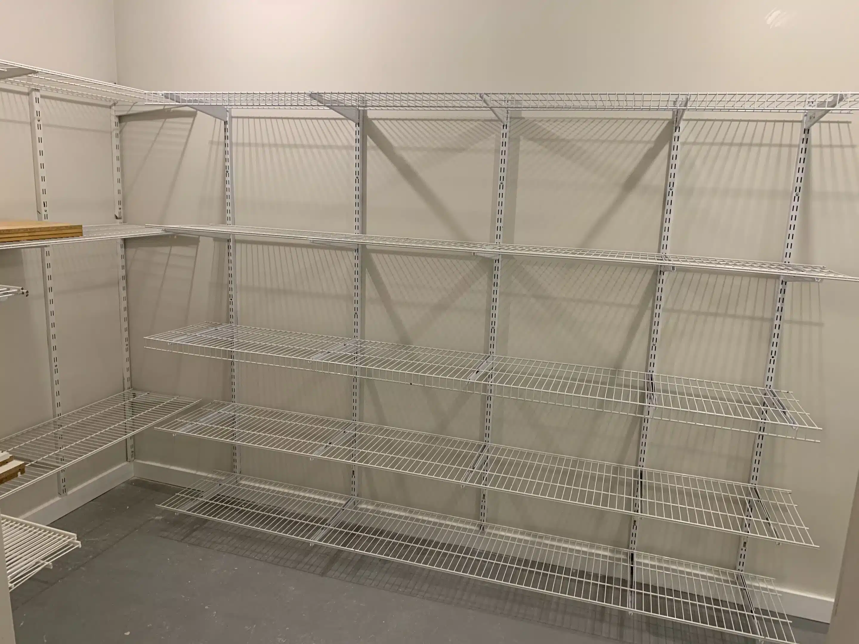 After: finished wall with installed rack system in Caledon