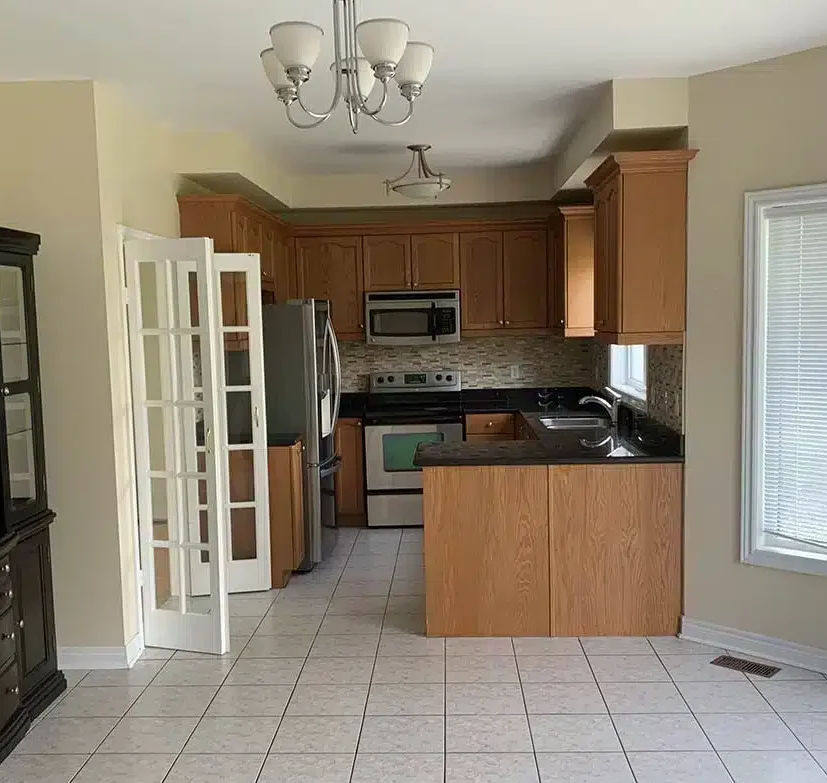 Before — dated kitchen surfaces prior to repaint in Caledon