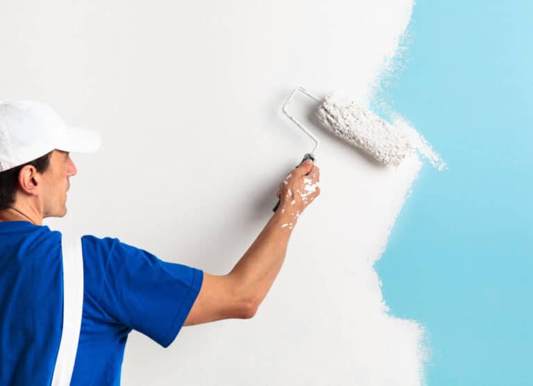 painter painting with paint roller