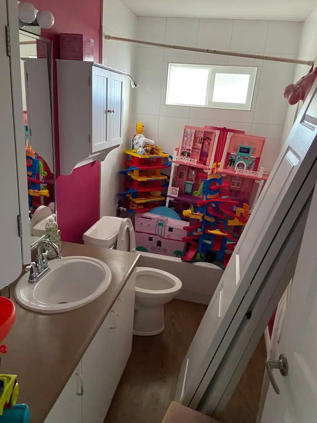 Bathroom before — worn finishes and dated fixtures