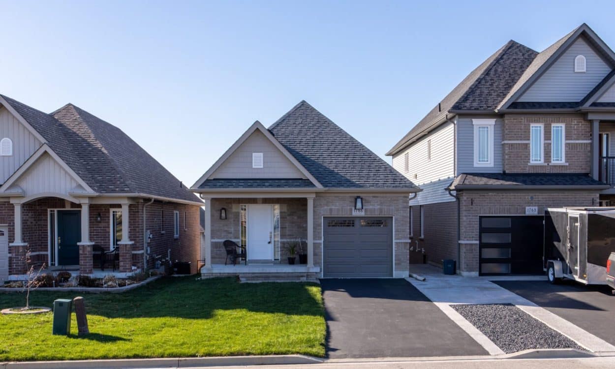 Newly built suburban homes with neutral tones and modern design elements.